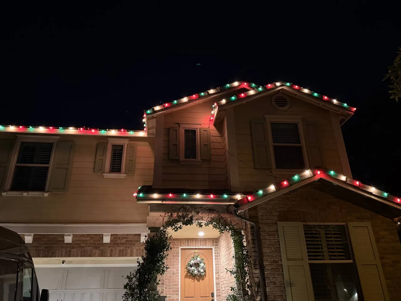 Roofline Christmas light installation on a two-story home in Henderson, NV - LvH Vegas Handyman Co